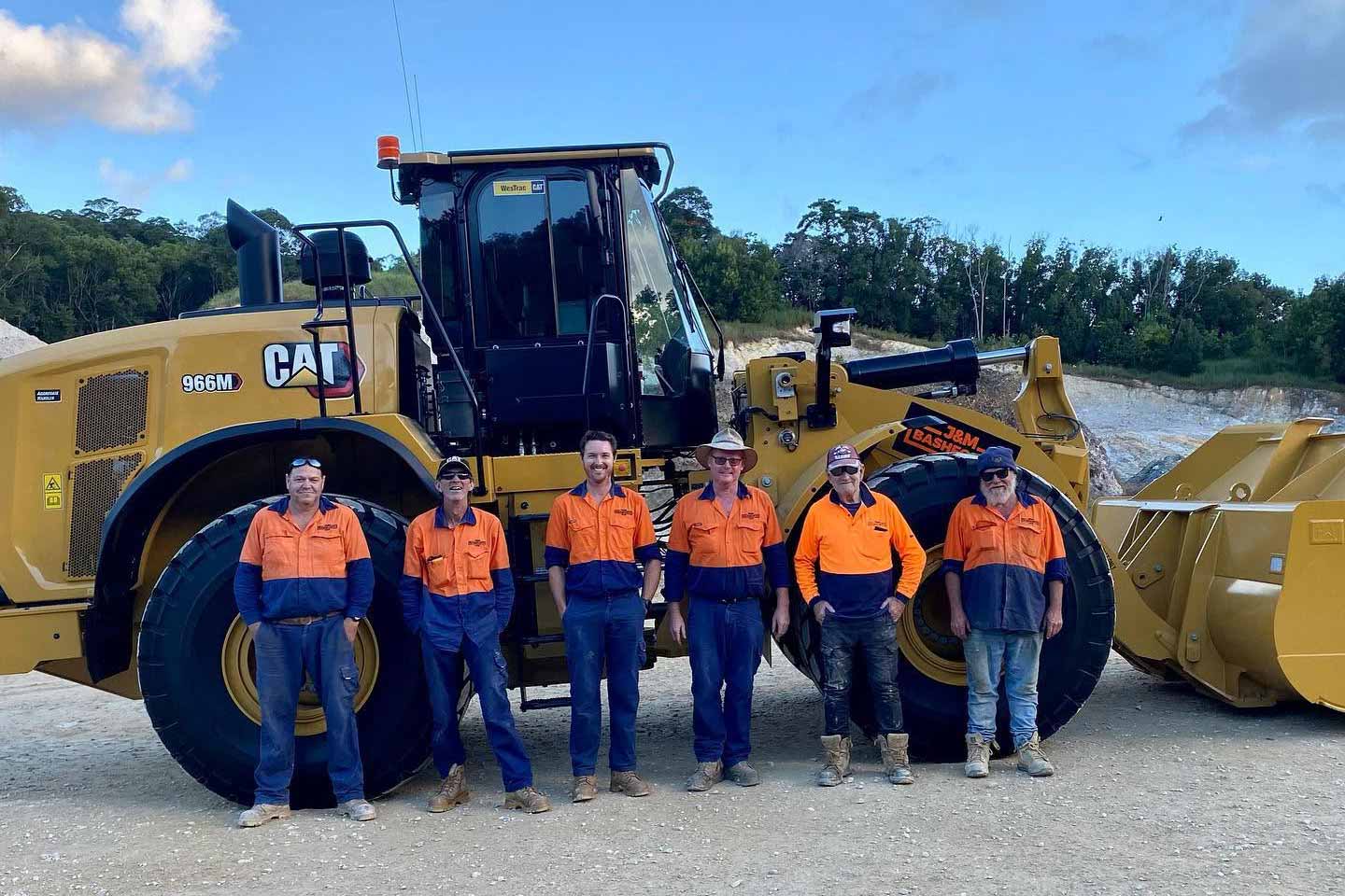 J&M Bashforth team standing in front of a CAT 966M